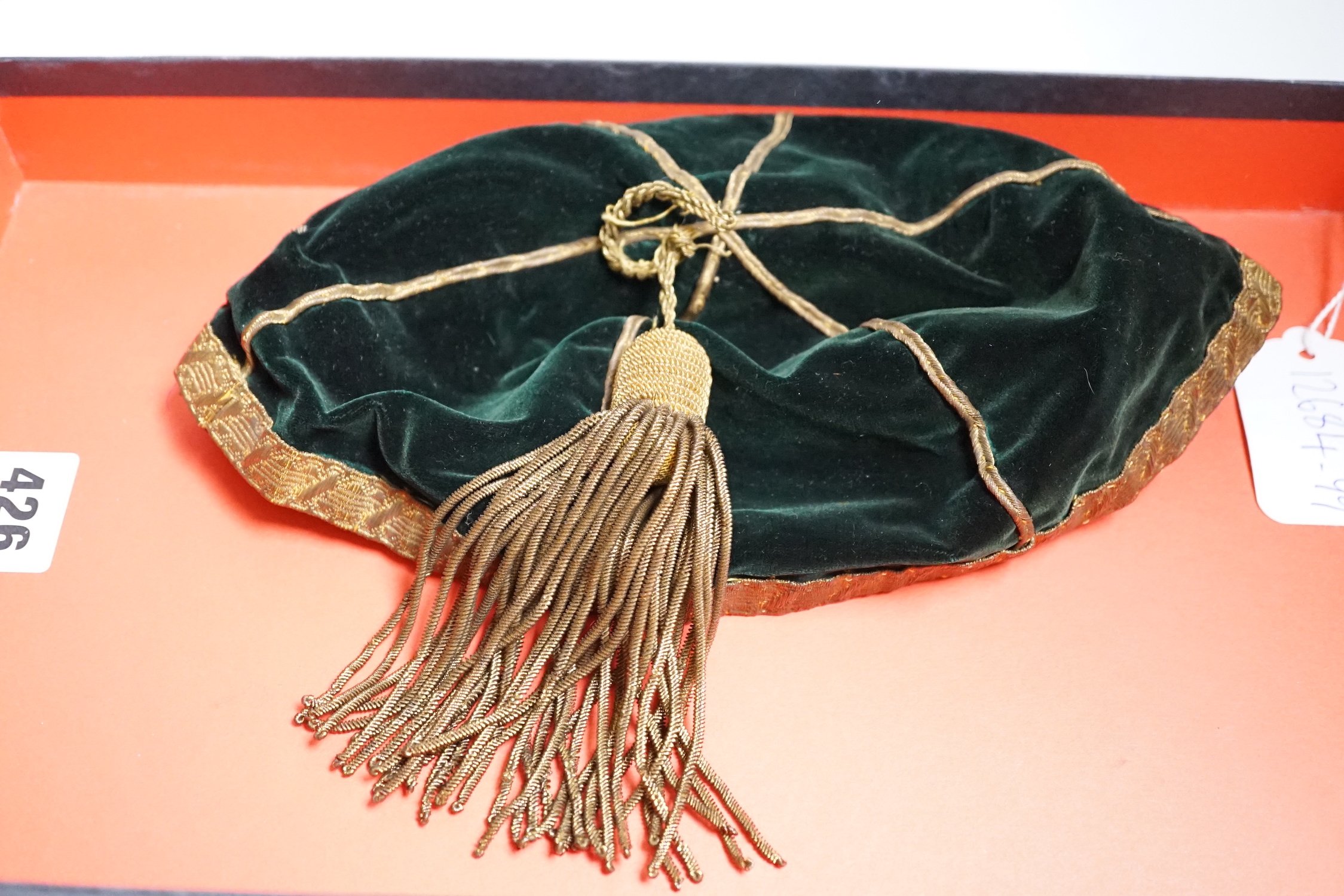 Two South African late 19th century damask railway napkins and a velvet rugby or cricketing cap
